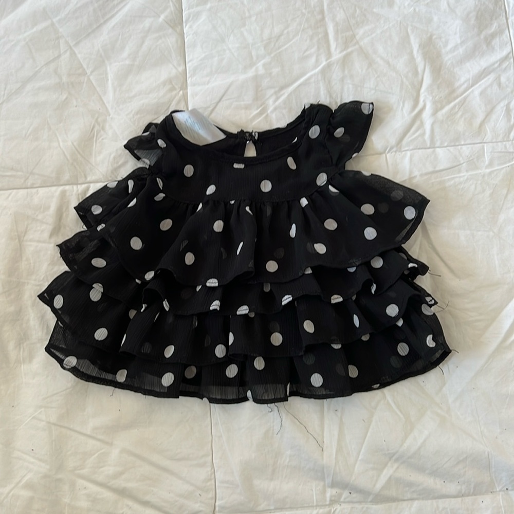 Small wonder black dress with white Polk a dots